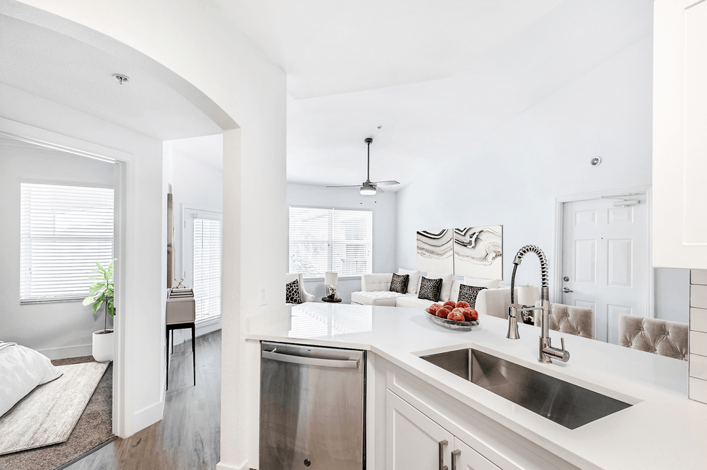 Open Kitchen with White Counters and Cabinets, Stainless Steel appliances